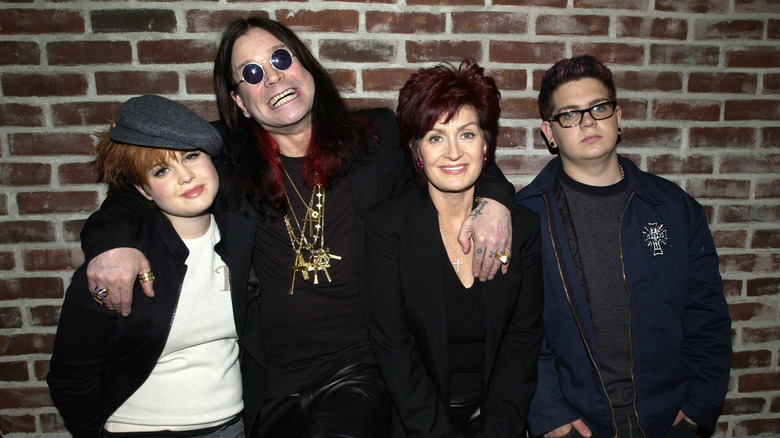 Ozzy and Sharon Osbourne posing with daughter Kelly and son Jack