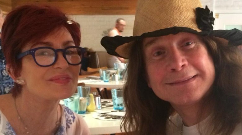 Sharon and Ozzy Osbourne smile on vacation