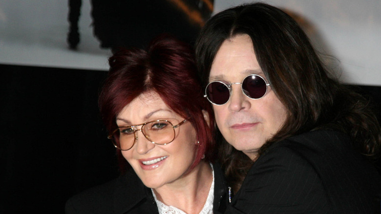 Sharon Osbourne and Ozzy Osbourne wearing glasses