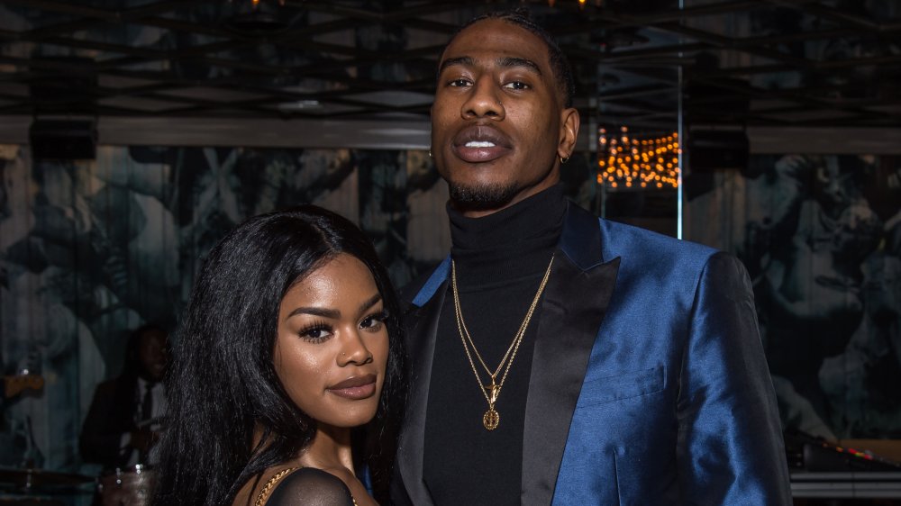 Teyana Taylor and Iman Shumpert, posing arm in arm