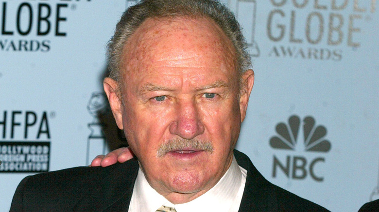 Gene Hackman, posing at an event