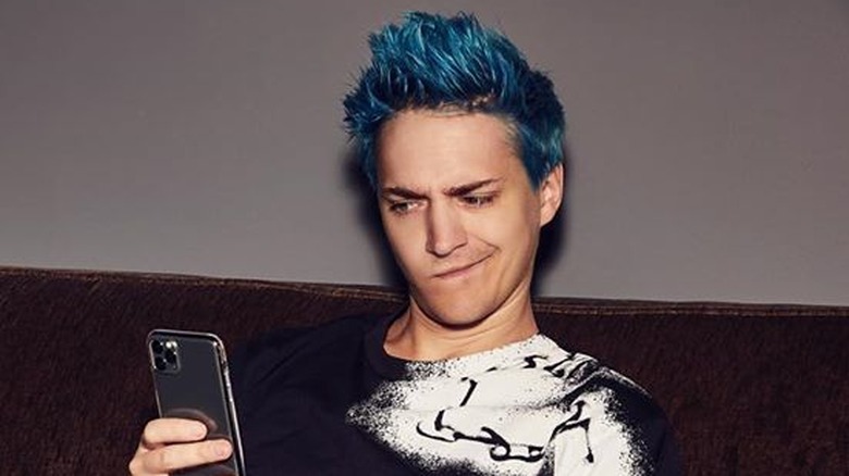 Ninja looks at his phone