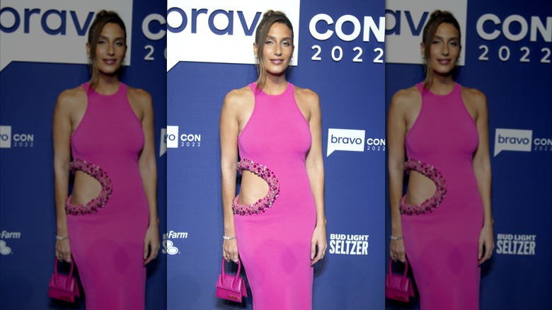 Amanda Batula on the red carpet at BravoCon in a hot pink dress in 2022