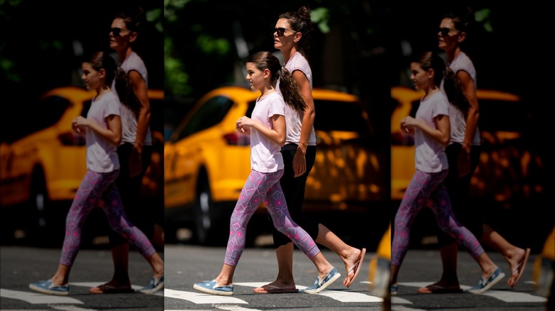 Katie Holmes and Suri Cruise walking