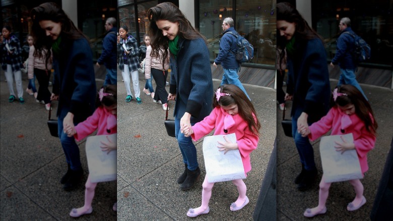 Katie Holmes holding Suri Cruise's hand