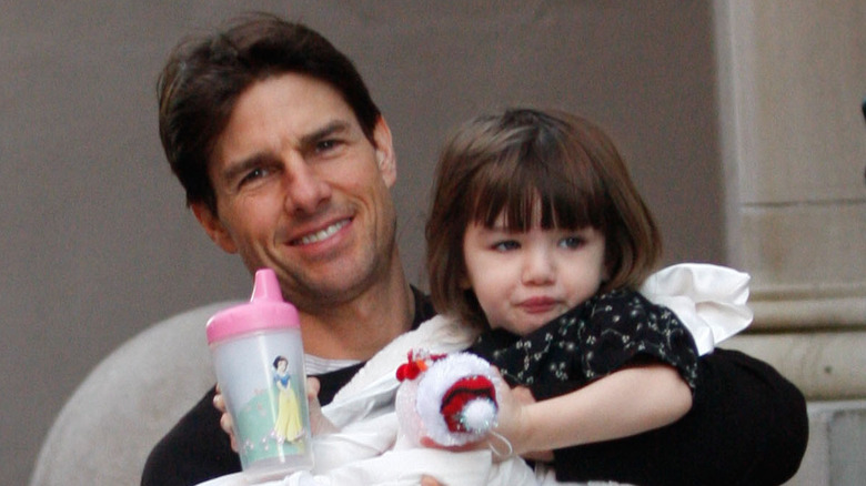 Tom Cruise holding Suri Cruise