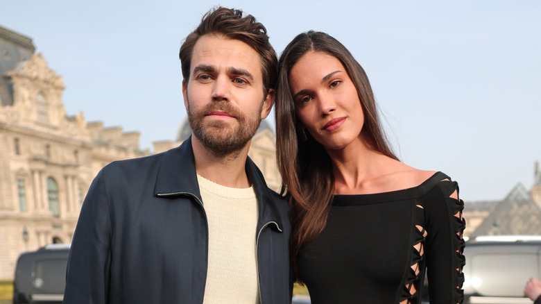 Paul Wesley and Natalie Kuckenburg standing together