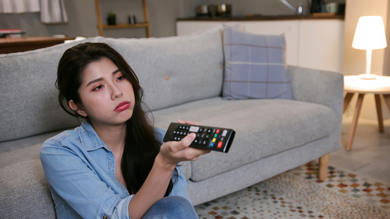 woman bored with TV