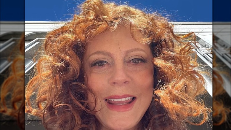 Susan Sarandon takes a selfie outdoors.