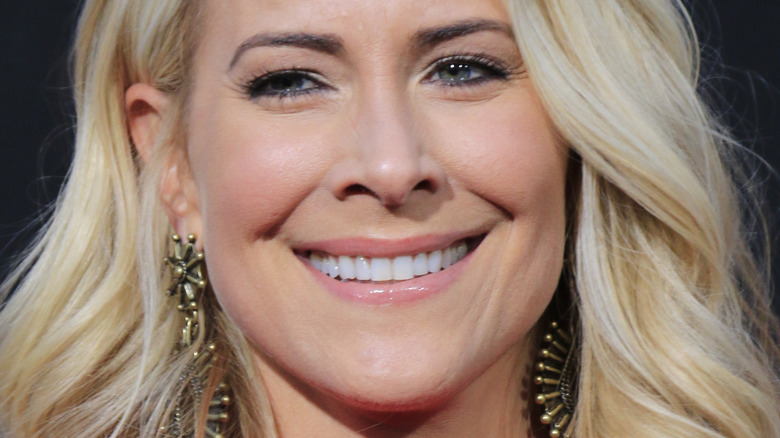 Brittany Daniel smiles at an event