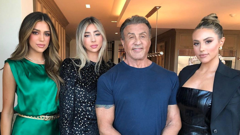 Sylvester Stallone poses with his three daughters 