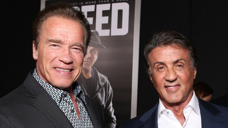 Arnold Schwarzenegger and Sylvester Stallone smiling