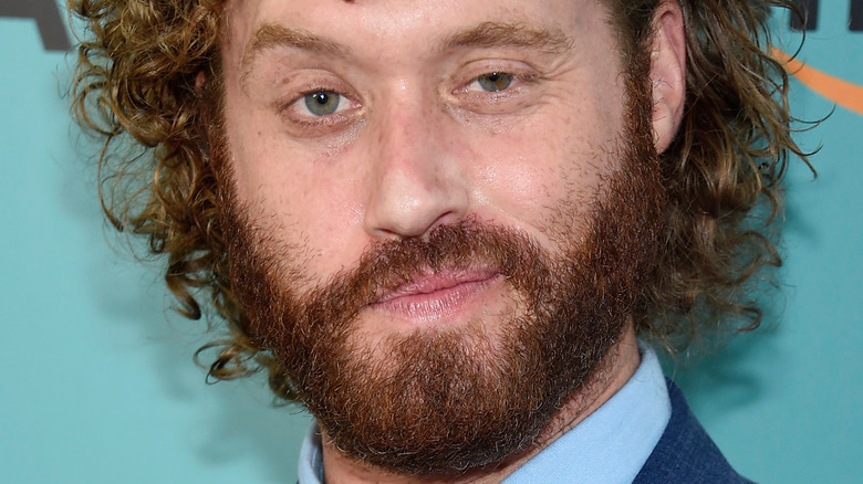 T.J. Miller smirking