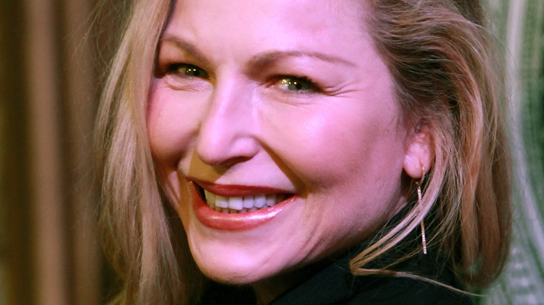 Tatum O'Neal red lip smiling