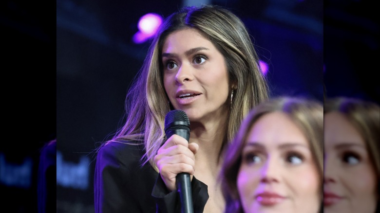 Taylor Frankie Paul speaking into a microphone during a group interview.