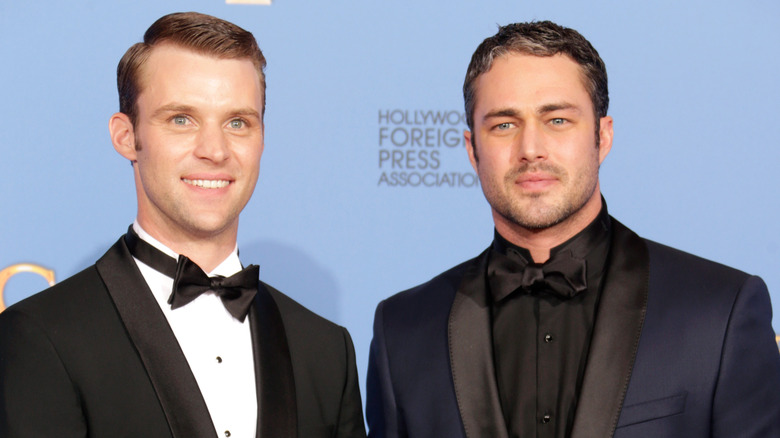 Jesse Spencer and Taylor Kinney posing