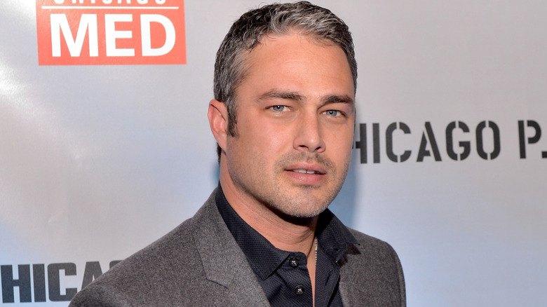 Taylor Kinney posing