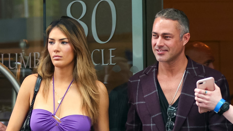 Ashley Cruger and Taylor Kinney candid