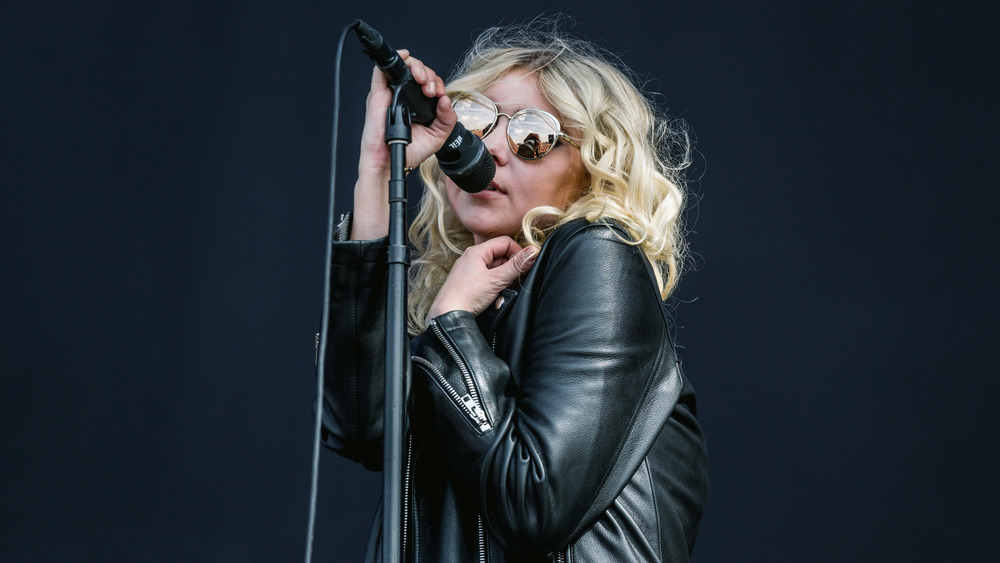 Taylor Momsen performing while wearing sunglasses