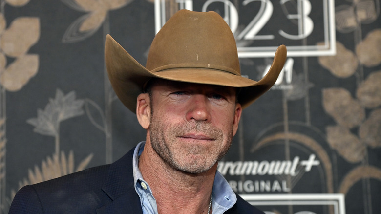 Taylor Sheridan posing in a cowboy hat