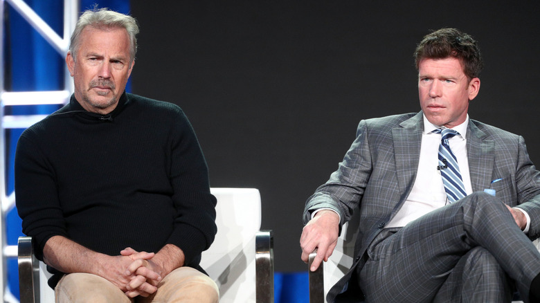Kevin Costner sitting with Taylor Sheridan.