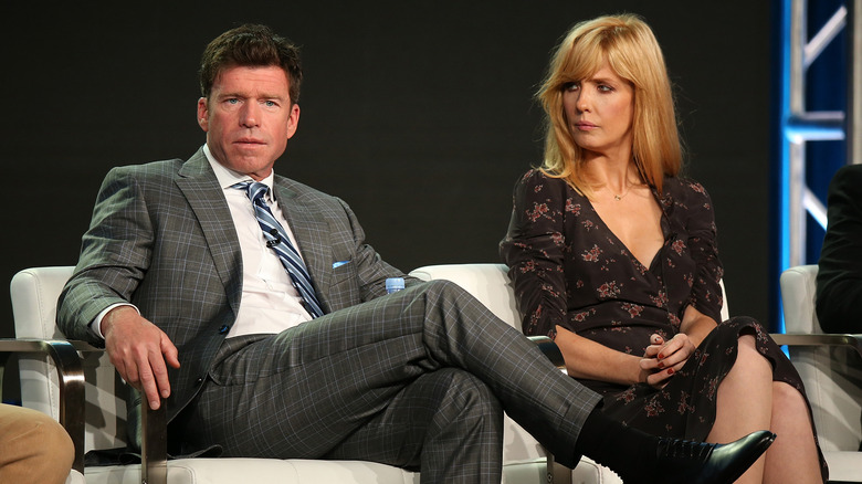 Kelly Reilly and Taylor Sheridan sitting onstage together during a press event