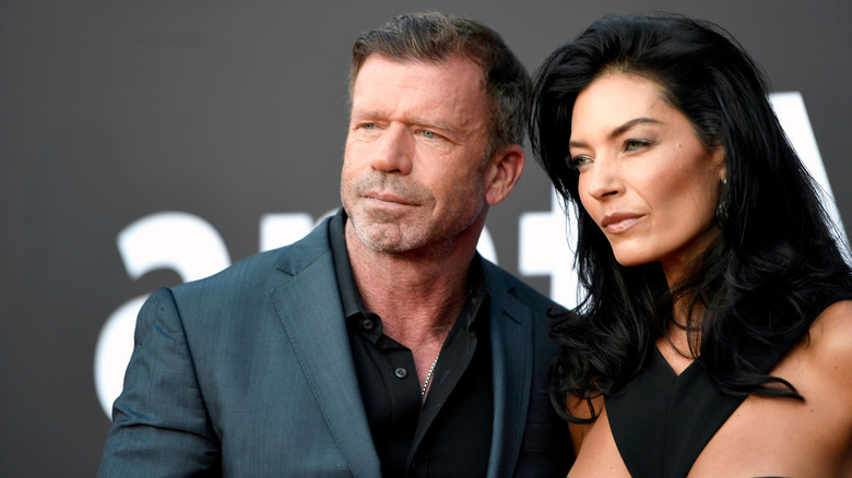 Up-close photo of Taylor Sheridan and Nicole Muirbrook in full glam on the red carpet.