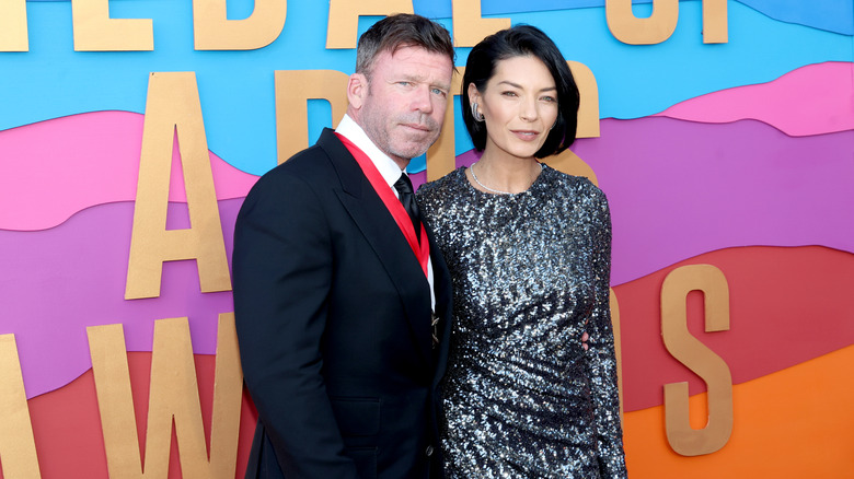 Taylor Sheridan and Nicole Muirbrook posing at the 2023 Texas Medal of Arts Awards.