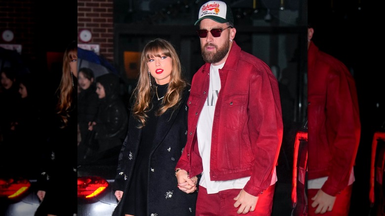 Taylor Swift and Travis Kelce walking hand in hand in New York City