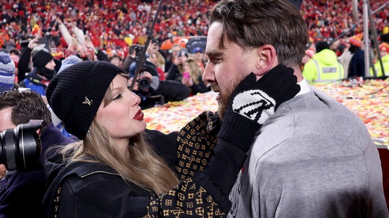 Taylor Swift celebrates with Travis Kelce on the field at Arrowhead Stadium in Kansas City, MO (2025)
