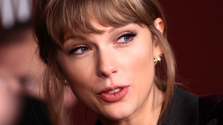 Taylor swift looking left smiling brown hair