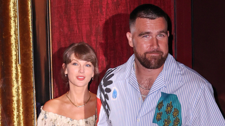 Taylor Swift walking with Travis Kelce.
