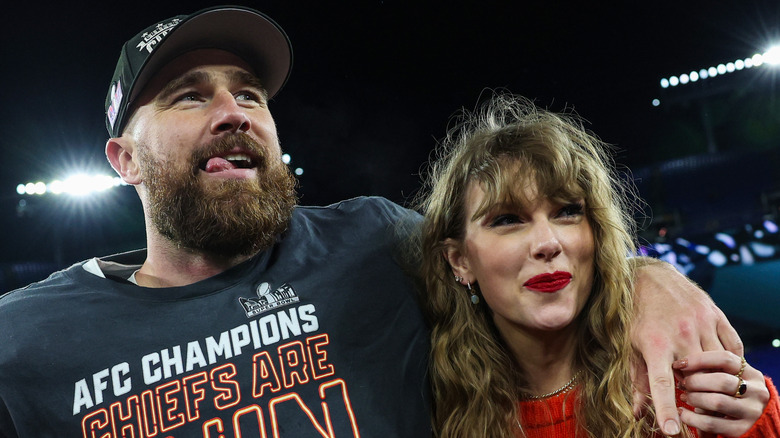 Travis Kelce hugs Taylor Swift on the football field