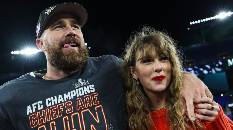Travis Kelce and Taylor Swift embracing