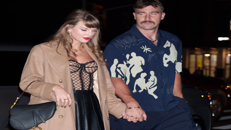 Taylor Swift and Travis Kelce walking together