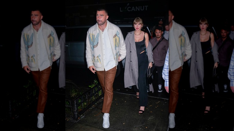 Travis Kelce and Taylor Swift holding hands at SNL Afterparty on October 15, 2023 in New York City.