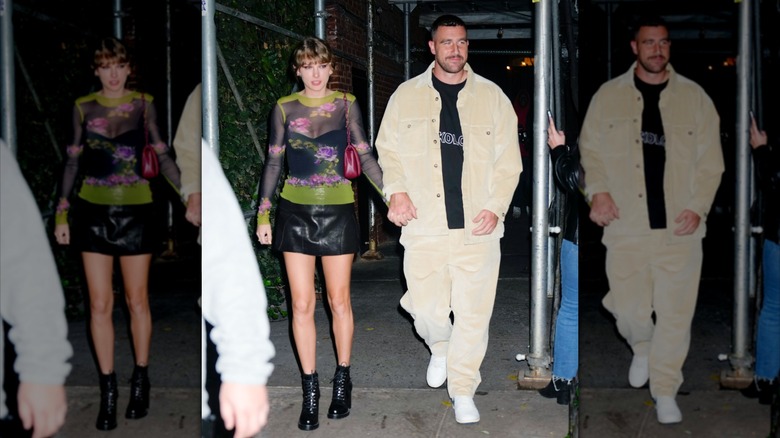 Taylor Swift and Travis Kelce holding hands at dinner in October 2023.
