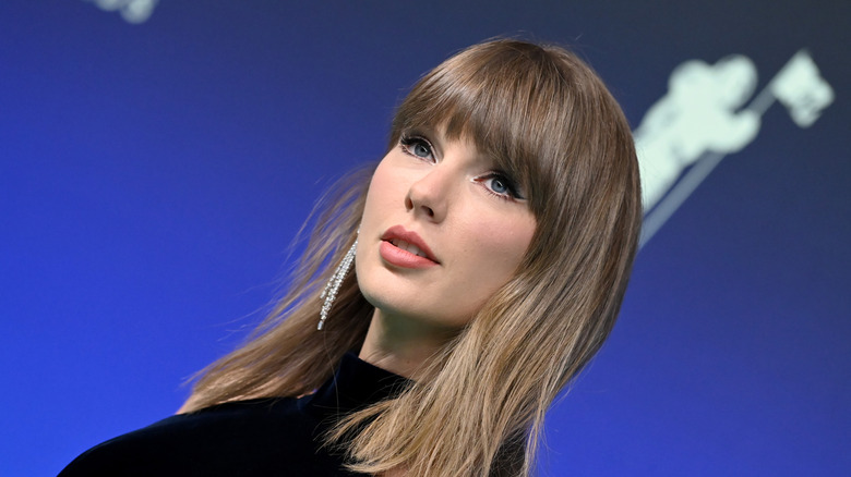 Taylor Swift with a long bob and bangs