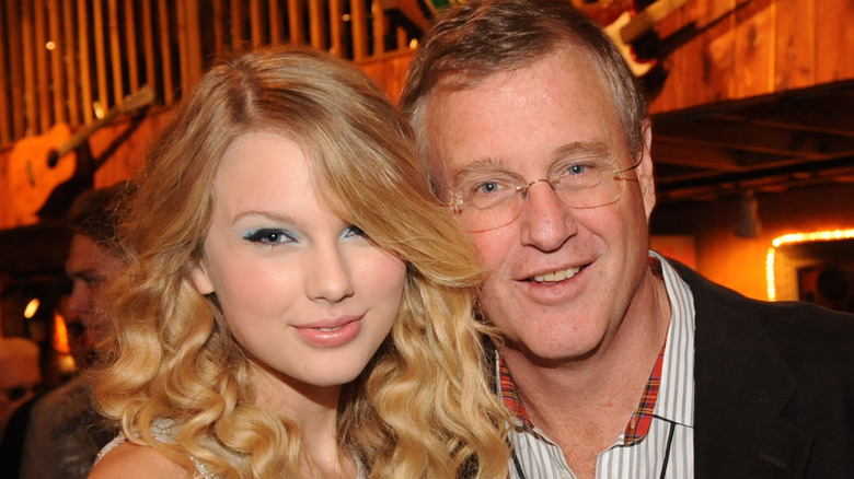 Taylor Swift posing with dad Scott Swift