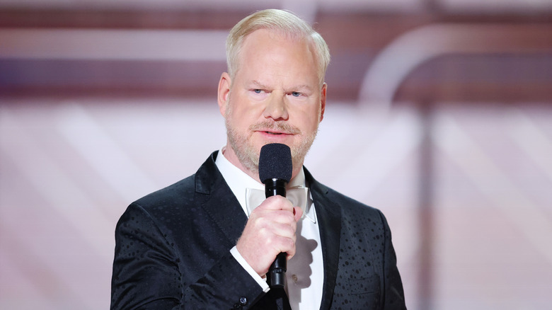 Jim Gaffigan speaks into a microphone