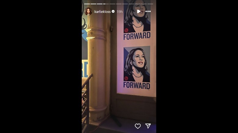 Karlie Kloss pointing back at Taylor Swift
