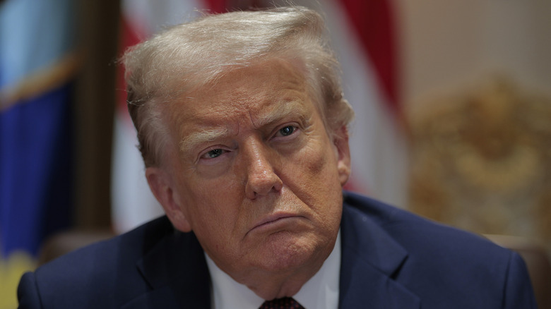 Donald Trump looking pensive during meeting