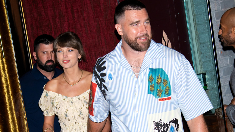Taylor Swift and Travis Kelce holding hands