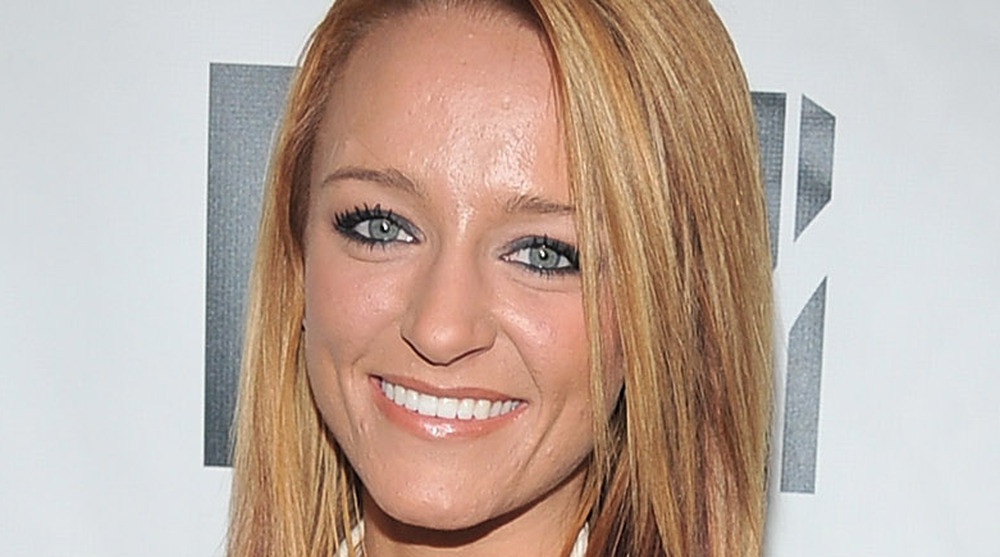 Maci Bookout smiles on the red carpet for a Teen Mom premiere