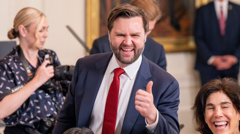 JD Vance gives a thumbs up and smiles