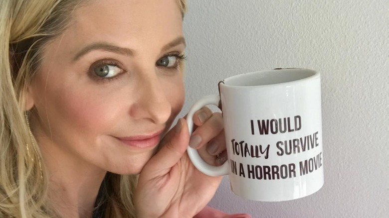 Sarah Michelle Gellar holding mug