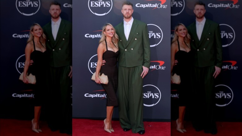 Kourtney Kellar Hartenstein wearing a black dress and Isaiah Hartenstein wearing a green suit at the 2025 ESPYs