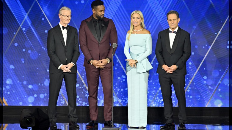 Steve Doocy, Lawrence Jones, Ainsley Earhardt, and Brian Kilmeade onstage