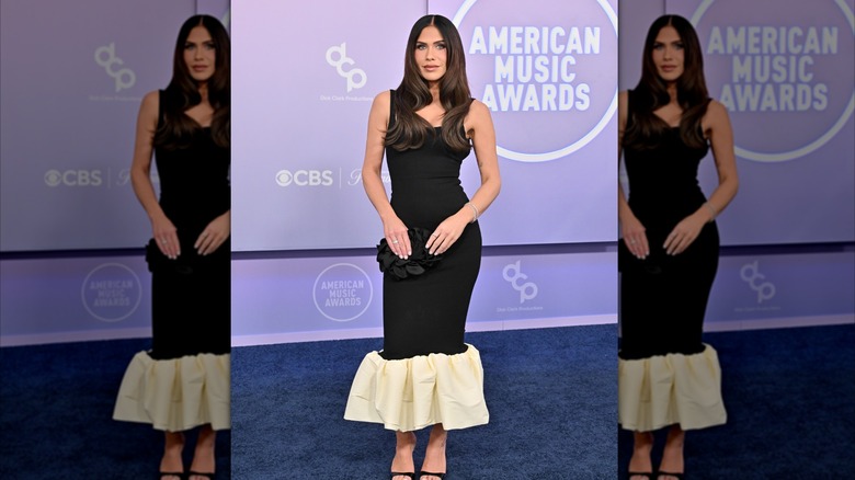 Jessi Draper wearing an ankle-length black gown with a large off-white ruffle on the bottom at the 2026 AMAs.