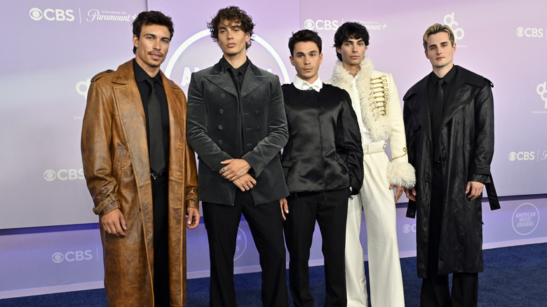 Elevator Boys boyband wearing outfits in neutral colors on the 2026 AMAs red carpet.